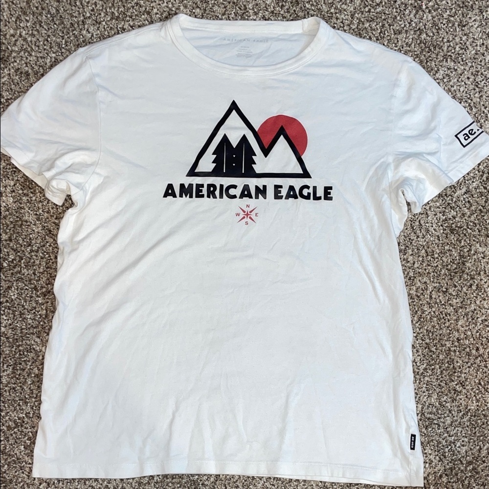 American Eagle Outfitters White Tee with Black Mountain Logo and Red Sun